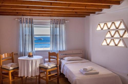 En eller flere senge i et værelse på Antoninis Village