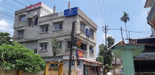 a building on the side of a street at Bridhi Guest House in Siliguri