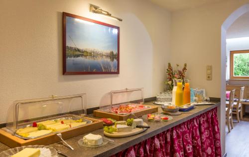 a buffet line with food on a table at otto steiner appartements pension ellmau & wilder kaiser in Ellmau
