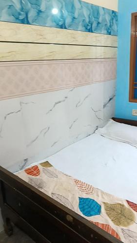 a close up of a bed in a room at Bridhi Guest House in Siliguri