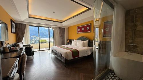 a hotel room with a bed and a bath tub at Fansipan View Hotel in Sa Pa