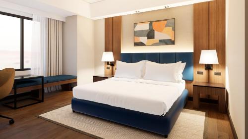 a hotel room with a bed and a desk at Seda Centrio Newly Renovated in Cagayan de Oro