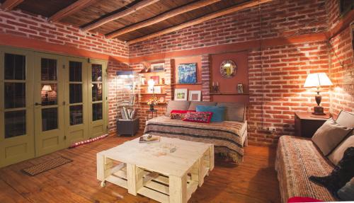 a living room with a couch and a table at En el Taller in San Salvador de Jujuy