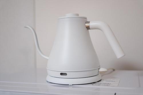 a white blender sitting on top of a counter at Tokyo Stay Akasaka in Tokyo
