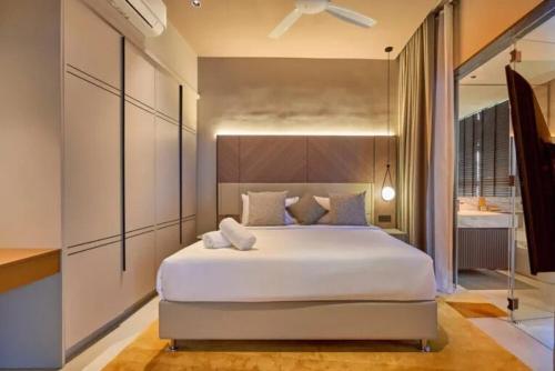 Ένα ή περισσότερα κρεβάτια σε δωμάτιο στο Executive Suites at Antara Genting Block C 1R1B