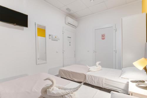 Postel nebo postele na pokoji v ubytování 7A Hostal