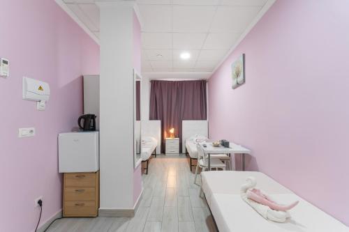 Postel nebo postele na pokoji v ubytování 7A Hostal