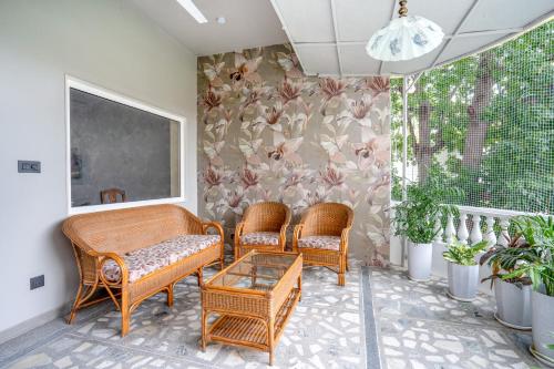 a living room with two chairs and a table at Girisadan Boutique Stay in Jaipur