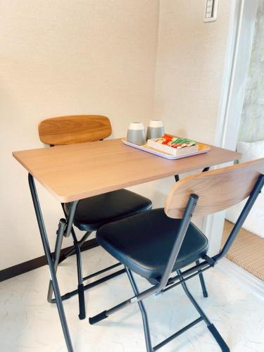 a wooden table and chair with a plate of food on it at seto sea in Takamatsu