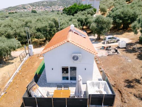 an aerial view of a white house with a roof at Lux Natura in Prinos