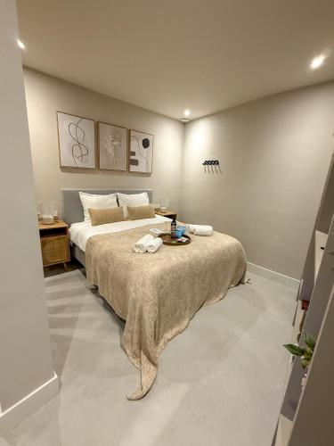 a bedroom with a bed with a blanket on it at B&B De Amsterdamse Poort in Haarlem