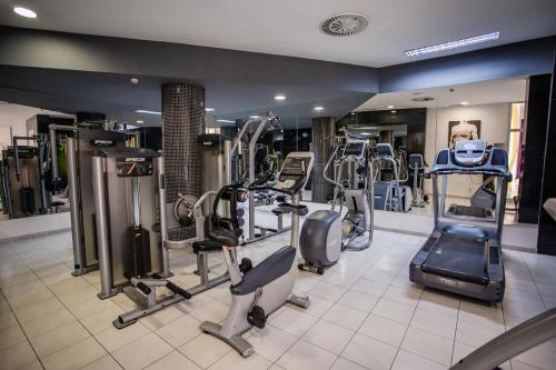 a gym with several treadmills and machines in it at Servatur Don Miguel - Adults Only in Playa del Ingles