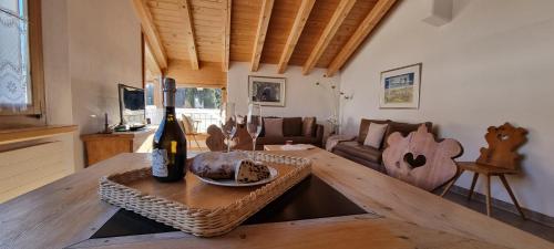 a living room with a table and a couch at Palü in Bever