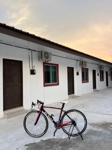 a bike parked in front of a building at Rumah No 5 in Taiping