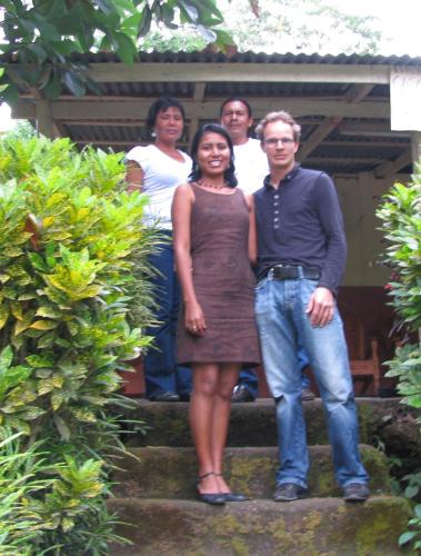 a man and a woman standing on some stairs at B&B, family run homestay, Hospedaje La Penita in Altagracia