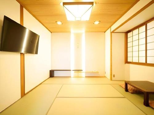 Hotel Riverge Akebonoにあるテレビまたはエンターテインメントセンター