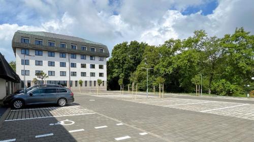 a car parked in a parking lot in front of a building at Hotel Globus in Prague
