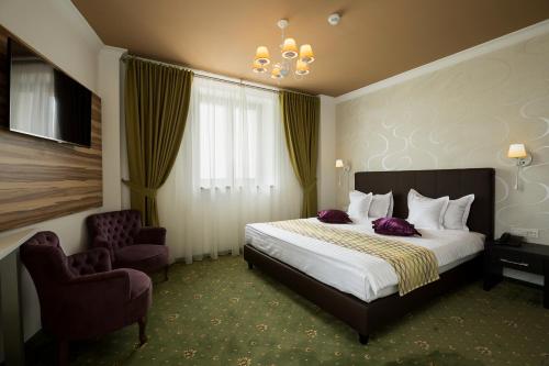 Postel nebo postele na pokoji v ubytování Hotel Saint Germain