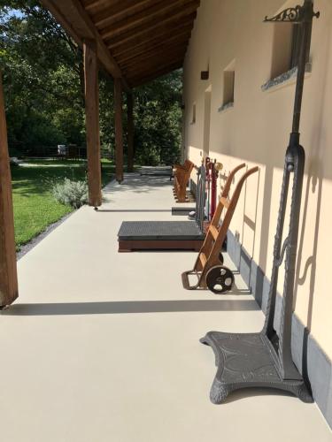 a porch of a house with a bench on it at Cascina Elide - Camere vista mare in campagna in Quiliano