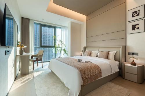 Ένα ή περισσότερα κρεβάτια σε δωμάτιο στο 故渝里-两室一卫