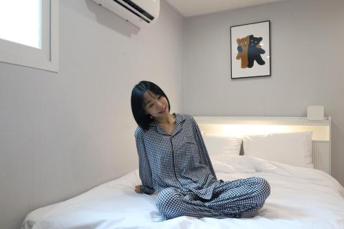 Un ou plusieurs lits dans un hébergement de l'établissement Hotel Mori