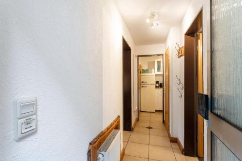 a hallway with a stairwell leading into a room at Auszeit Sauerland in Olsberg