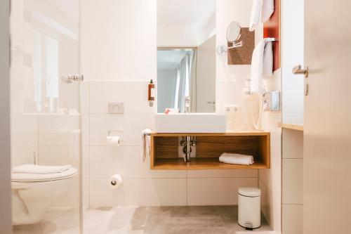 Salle de bains dans l'établissement Fuchsbräu