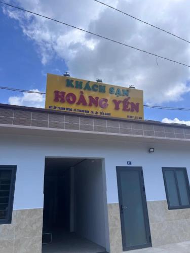 a sign on top of a building with a home sign at Hoàng Yến Hotel Thanh Hoà in Cai Lậy