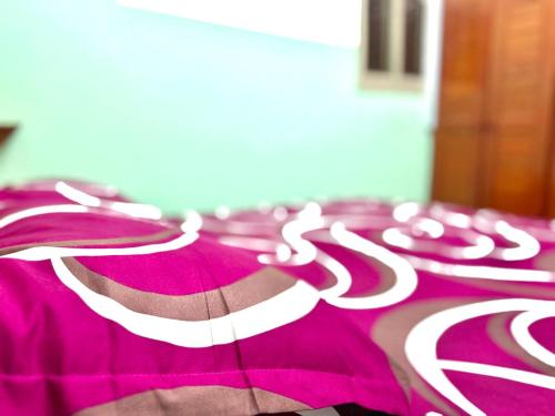 a bed with red and white candy canes on it at Luxury apartment Yaoundé in Yaoundé