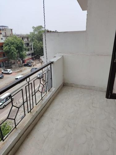 a balcony with a view of a street at Poonam's Nest in Faridabad