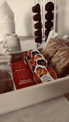 a tray of sandwiches and a loaf of bread at Casa Vacanze Ogliarola in Manduria