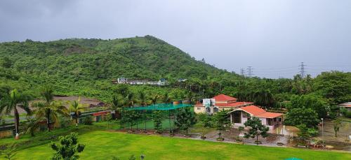 an aerial view of a house and a mountain at HillRock Resort & Villas, Neral-Karjat in Karjat