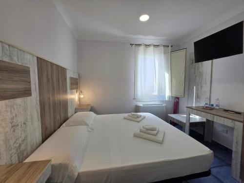 Postel nebo postele na pokoji v ubytování Residenza Calypso