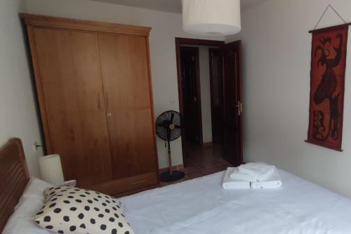 Ένα ή περισσότερα κρεβάτια σε δωμάτιο στο Apartamento O Mon