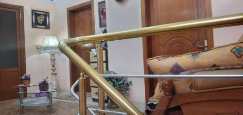 a room with a couch with a tattoo on it at Vila Elio in Pogradec