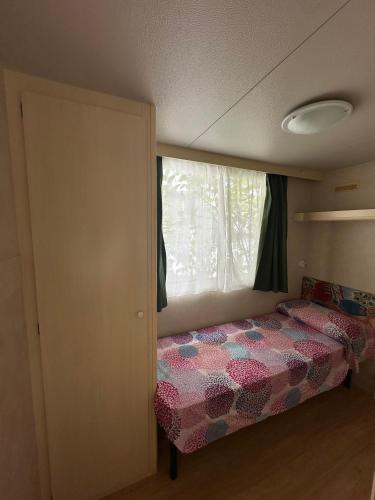 Ένα ή περισσότερα κρεβάτια σε δωμάτιο στο Camping San Michele