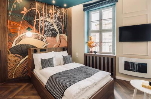 a bedroom with a bed and a wall mural at 8 - Il Becco Rosato - DonViore in Győr