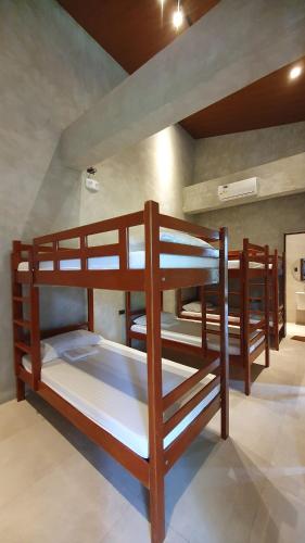 a group of bunk beds in a room at Dylan's Hot Spring in Los Baños