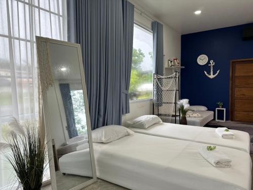 Ένα ή περισσότερα κρεβάτια σε δωμάτιο στο Napa Homestay