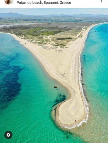 an aerial view of a beach near the ocean at Ktima Lena in Órmos