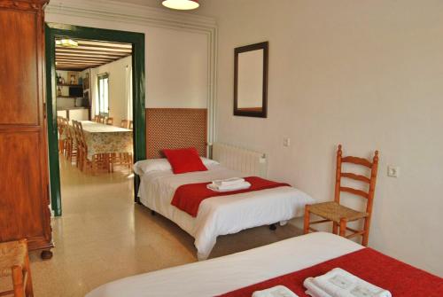 Giường trong phòng chung tại Casa La Muralla