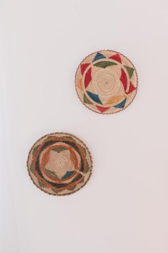 two bowls of food sitting on a white table at Curolla Petit Hotel in Maria de la Salut