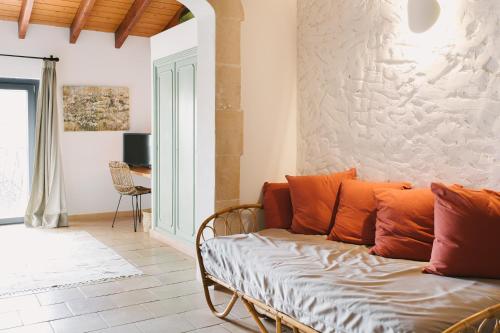 a living room with a couch and a table at Curolla Petit Hotel in Maria de la Salut