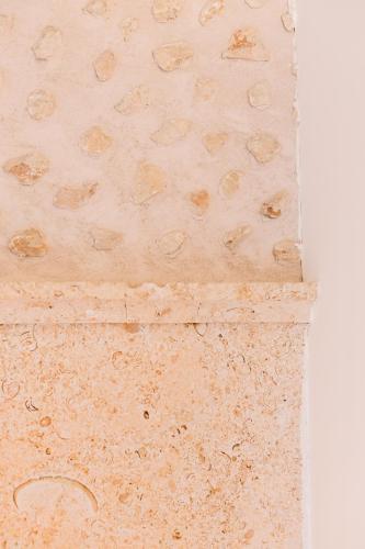 a close up of a stone wall at Curolla Petit Hotel in Maria de la Salut