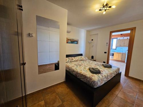 a bedroom with a bed and a walk in shower at Villa Puglia AR 700m from beach -max 4 people- in Bisceglie