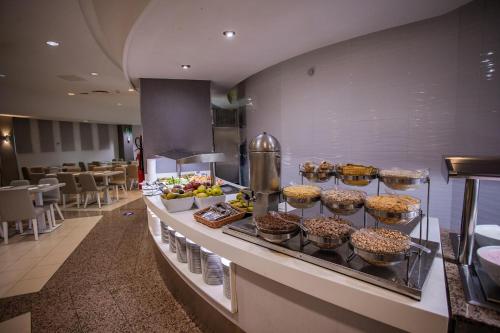 a buffet line with many different types of food at Servatur Waikiki in Playa del Ingles