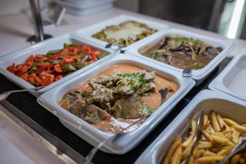 four plastic containers filled with different types of food at Servatur Waikiki in Playa del Ingles