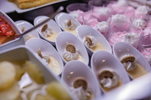 a table topped with plates of oysters and other foods at Servatur Waikiki in Playa del Ingles