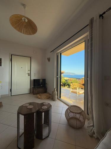 a living room with a large sliding glass door at Lumiere Glyfada 1 in Glyfada