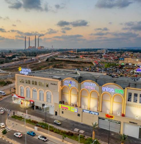 an overhead view of a building in a city at בית הקונגרס גבעת אולגה in H̱adera